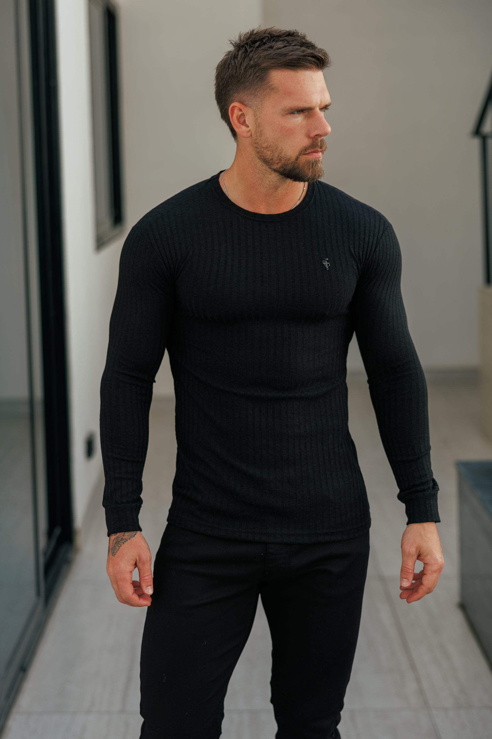 Super Slim Black Ribbed Knit Jumper With Black Metal Emblem - FSH1443