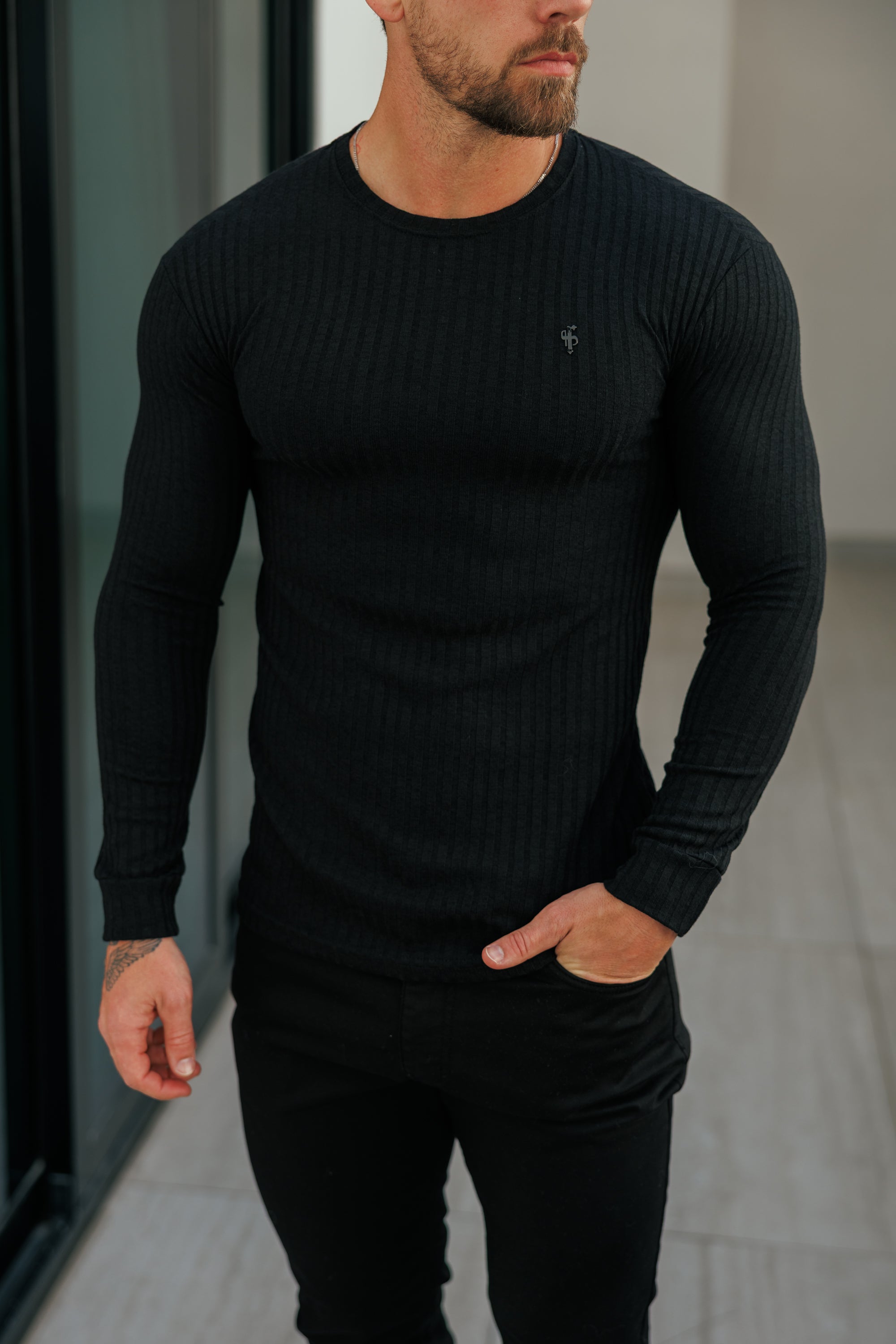 Super Slim Black Ribbed Knit Jumper With Black Metal Emblem - FSH1443