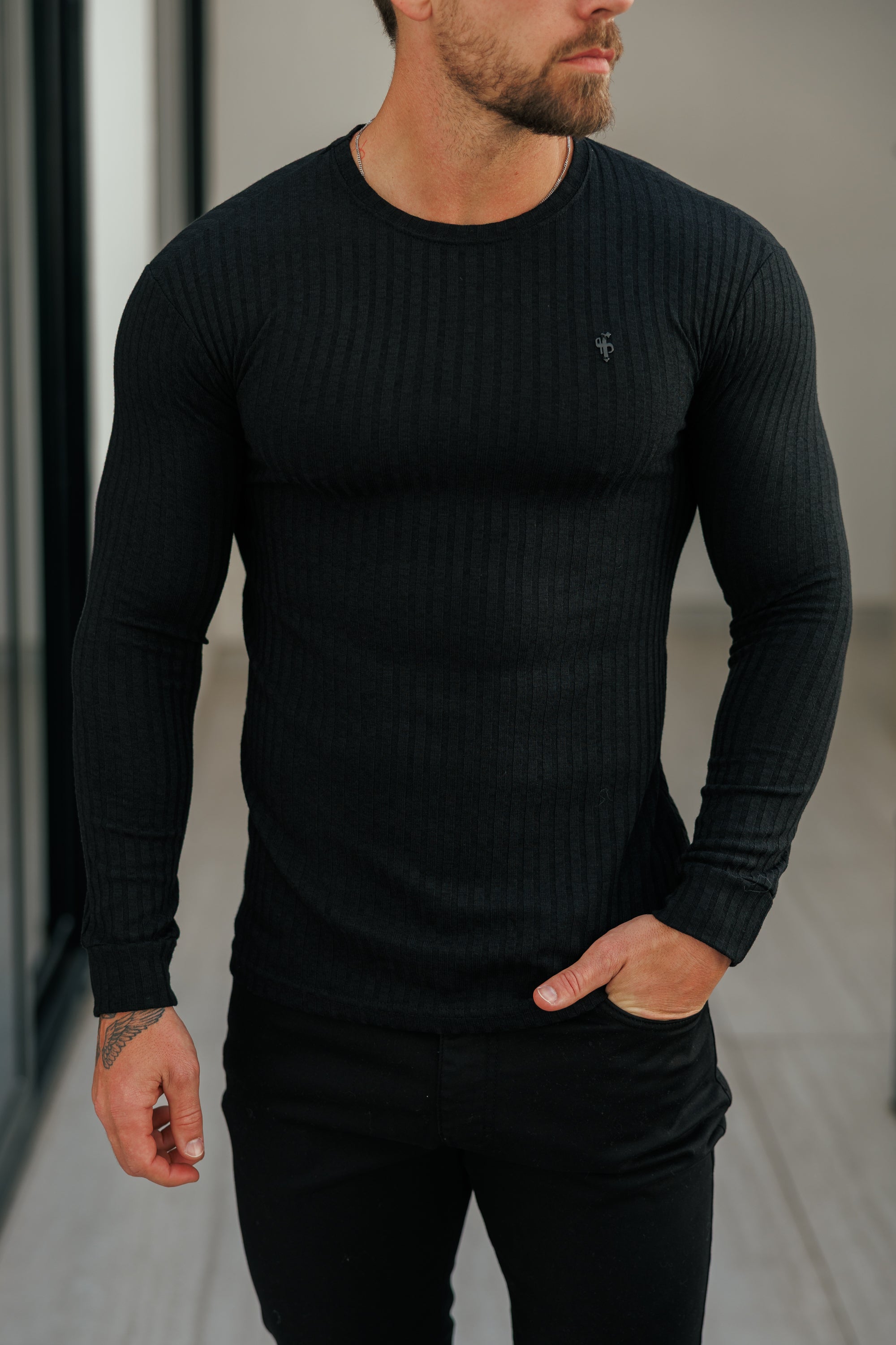 Super Slim Black Ribbed Knit Jumper With Black Metal Emblem - FSH1443